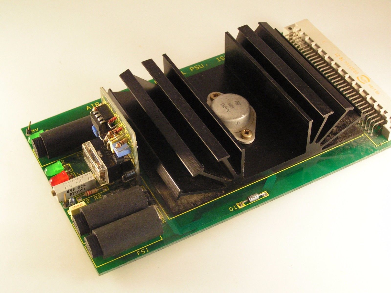 An LM317K Heat Sink PCB With Harris ICL 8211 IC Relay Trimpot Caps LEDs